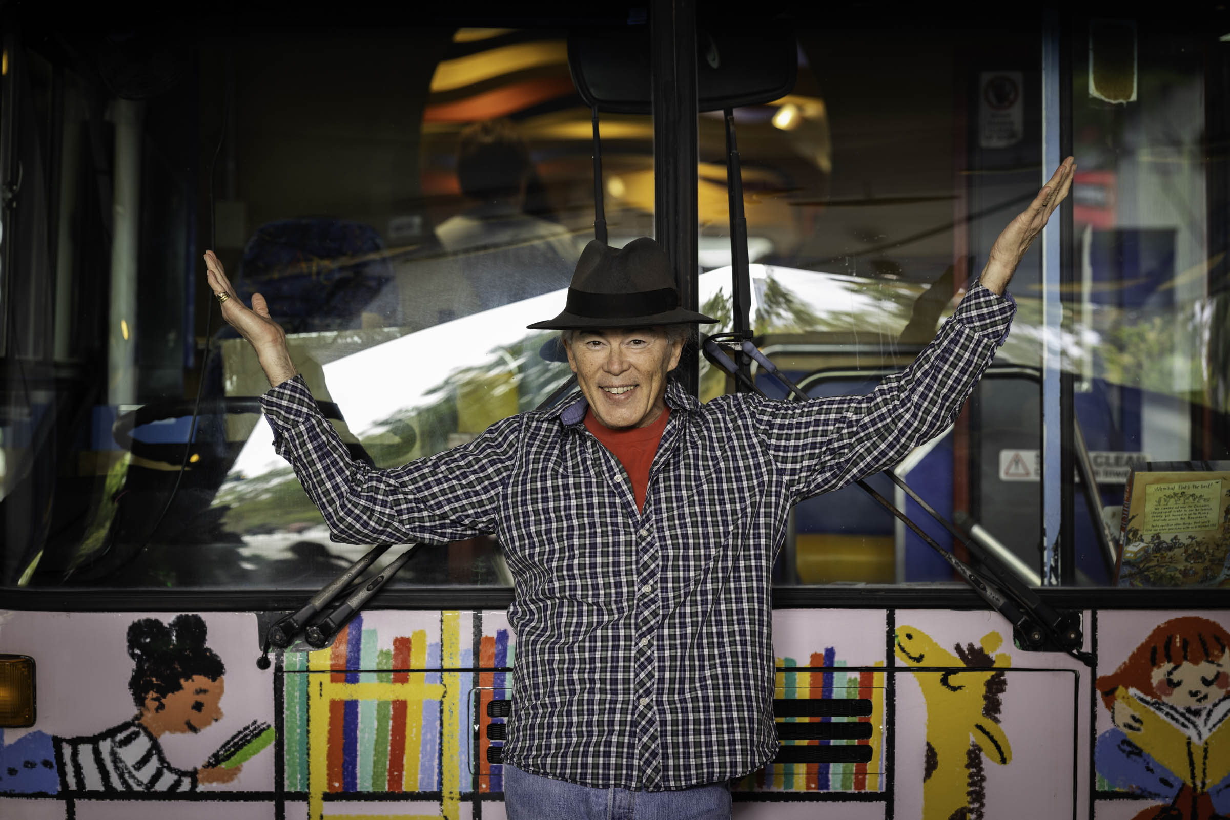 Christopher in front of Russ the Bus at Darling Harbour